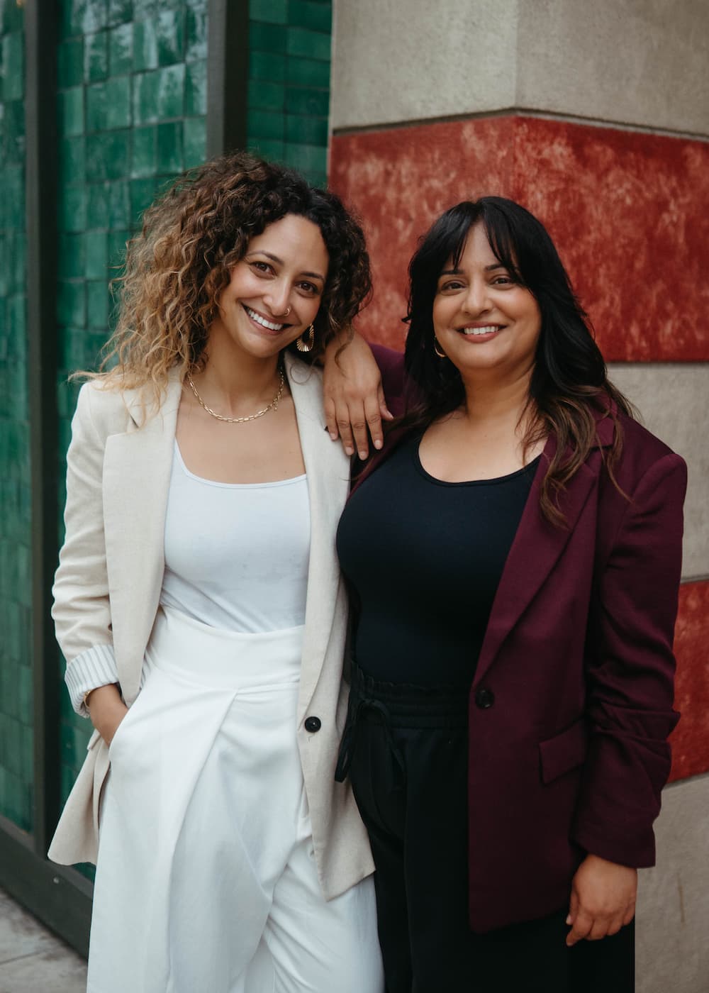image of two women standing next to each other confidently